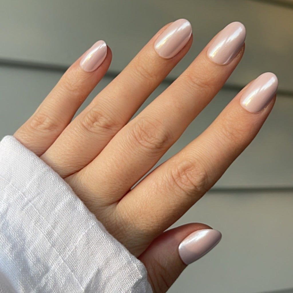 Girl wearing Instant Mani Co. Posy Pink Chrome press on nails 