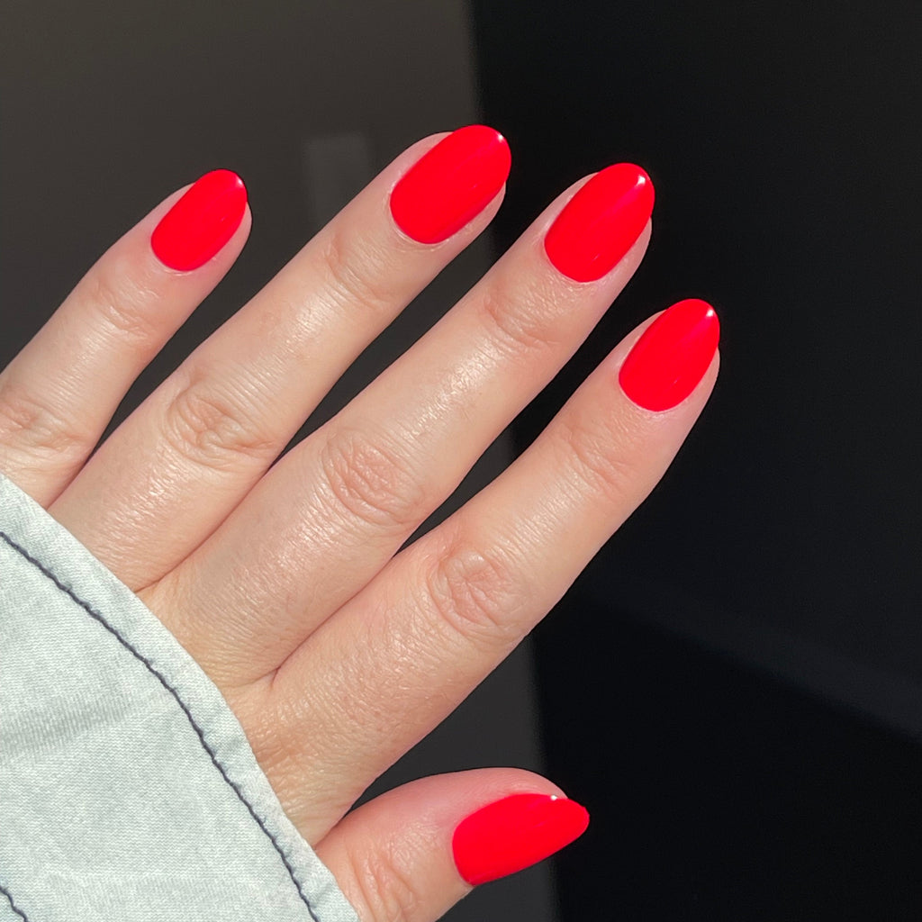 Girl wearing Instant Mani Co. Spicy Red press on nails 