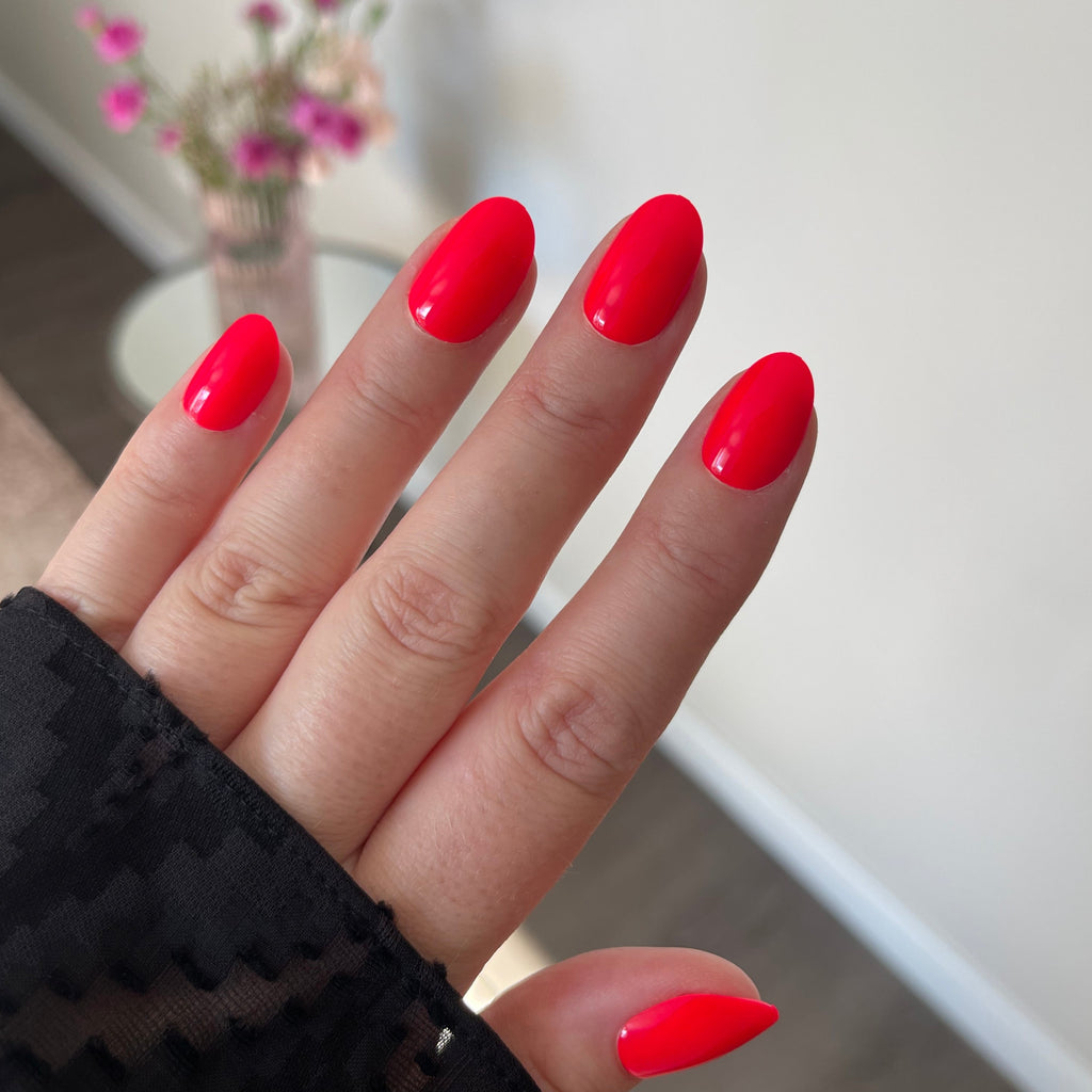 Girl wearing Instant Mani Co. Spicy Red press on nails 