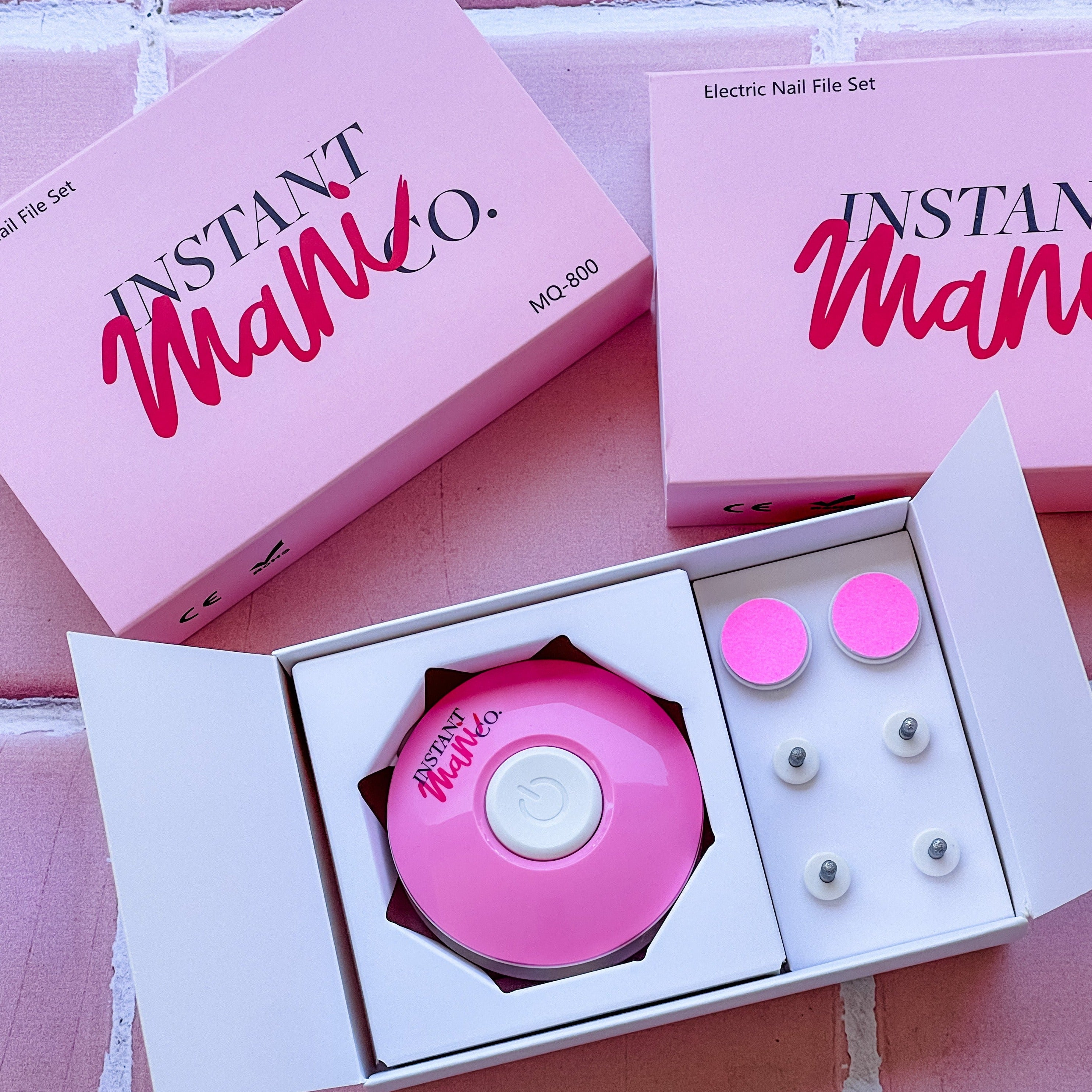 Instant Mani Electric Efile sitting on pink background