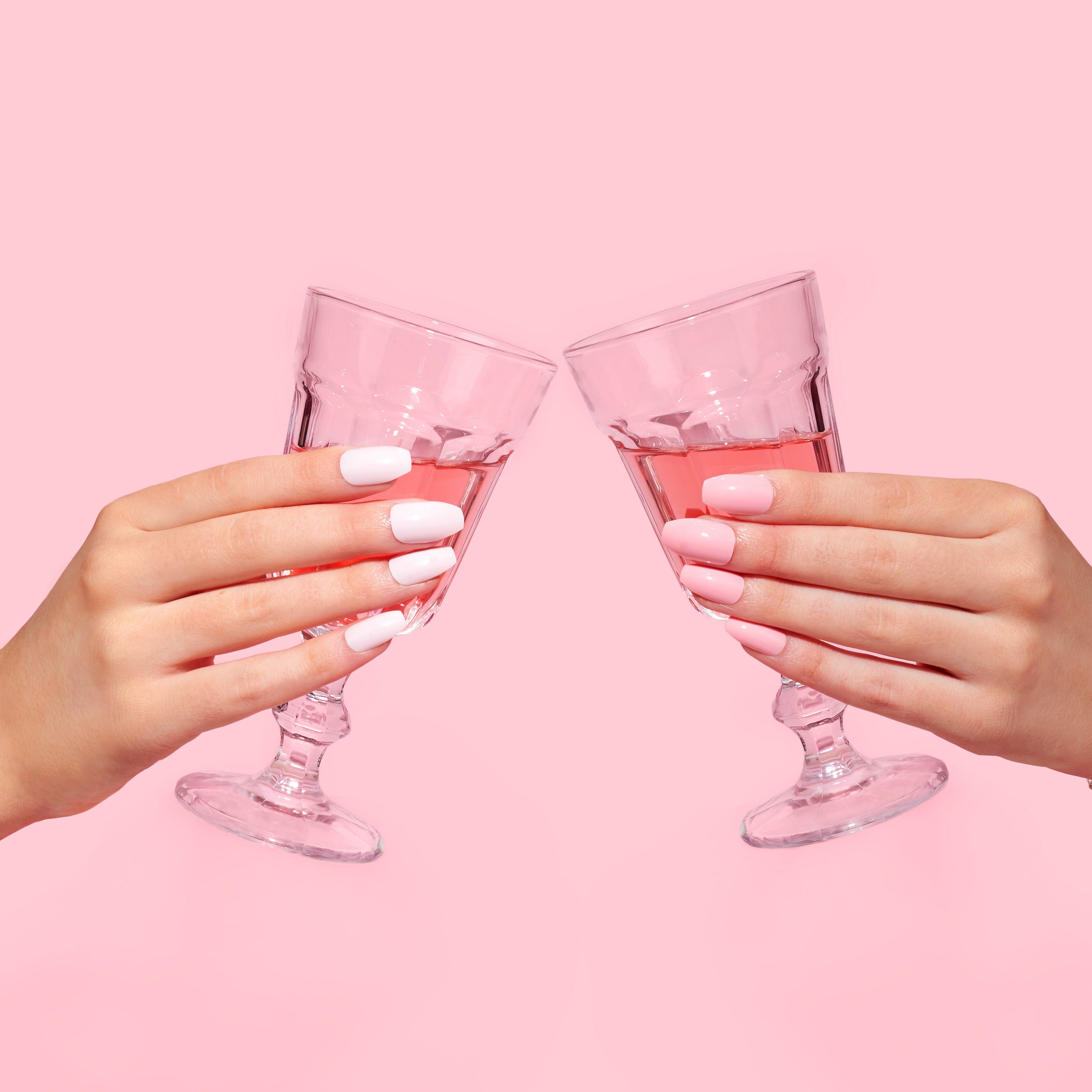 cheersing drinks, wearing pink press-on nail