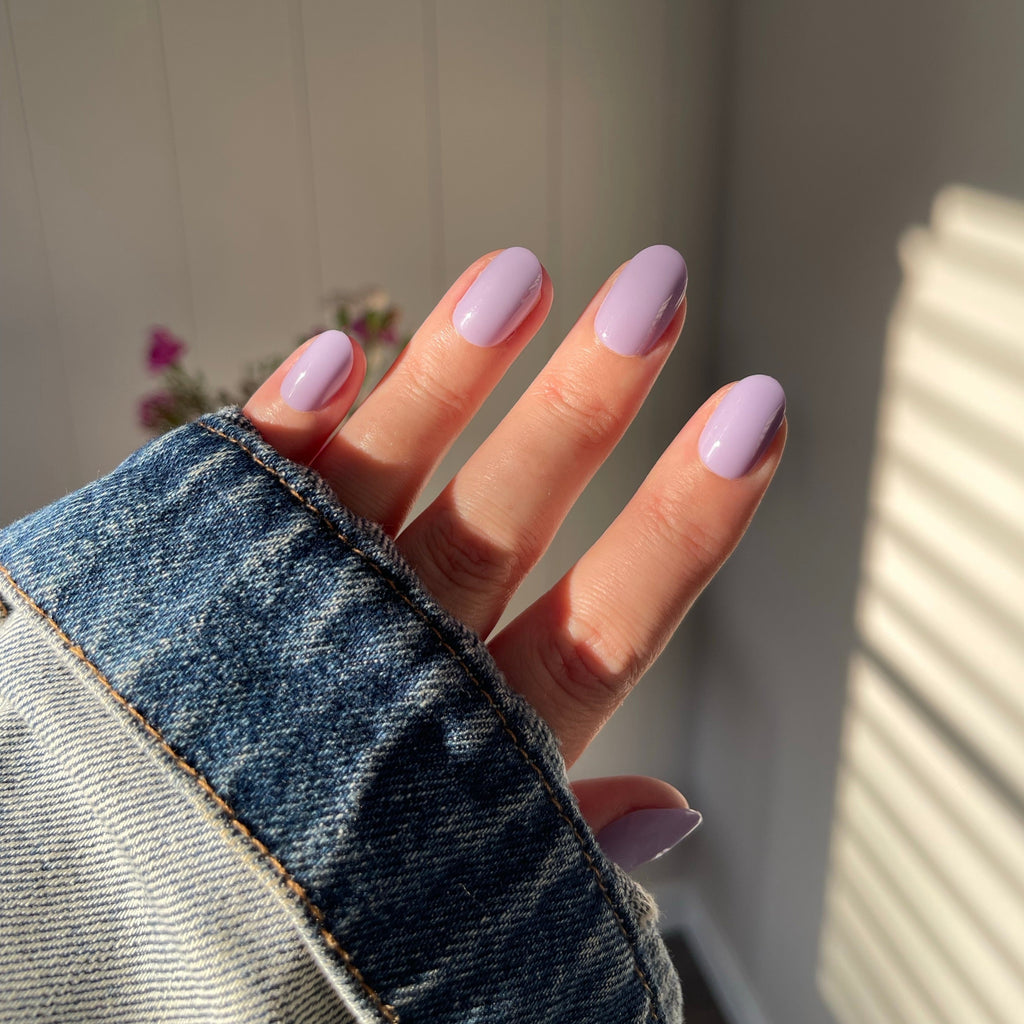 Girl wearing Instant Mani Co. Wisteria purple press on nails 