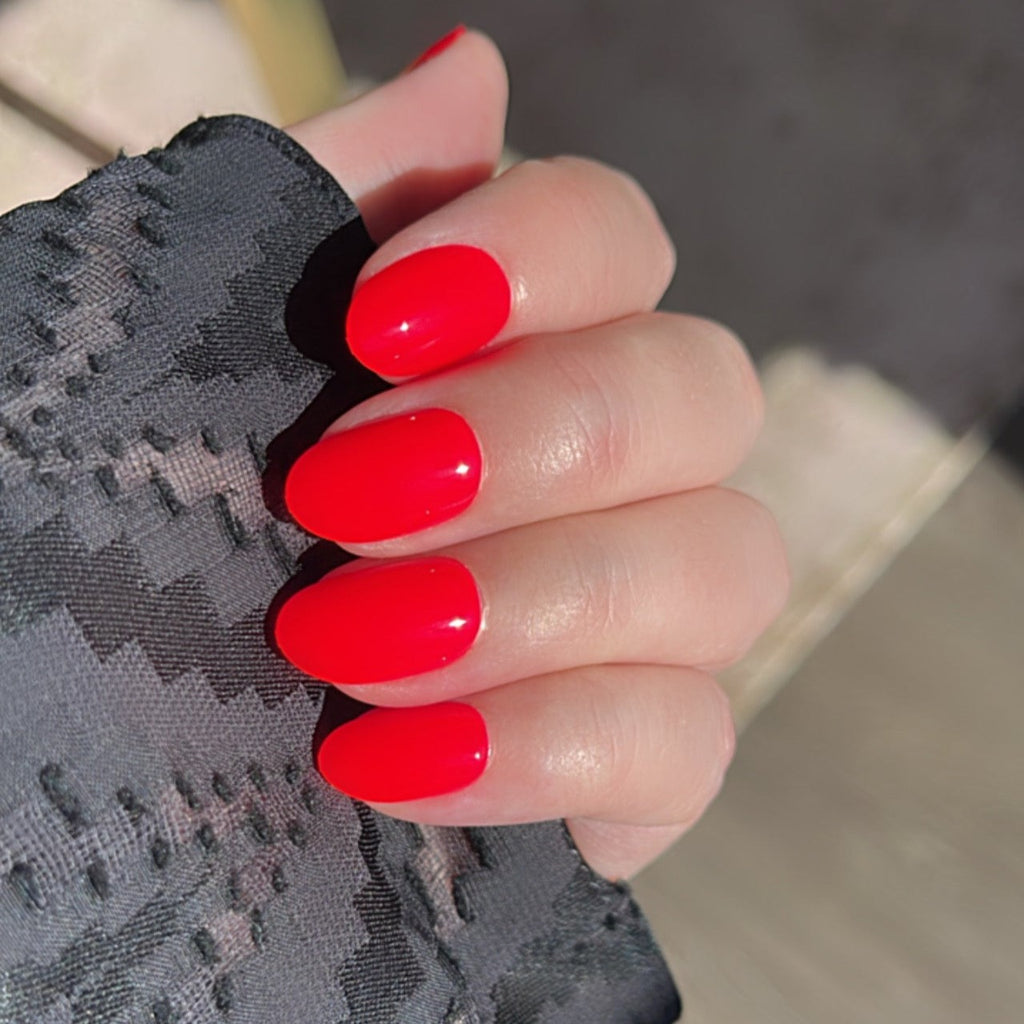 Girl wearing Instant Mani Co. Spicy Red press on nails 