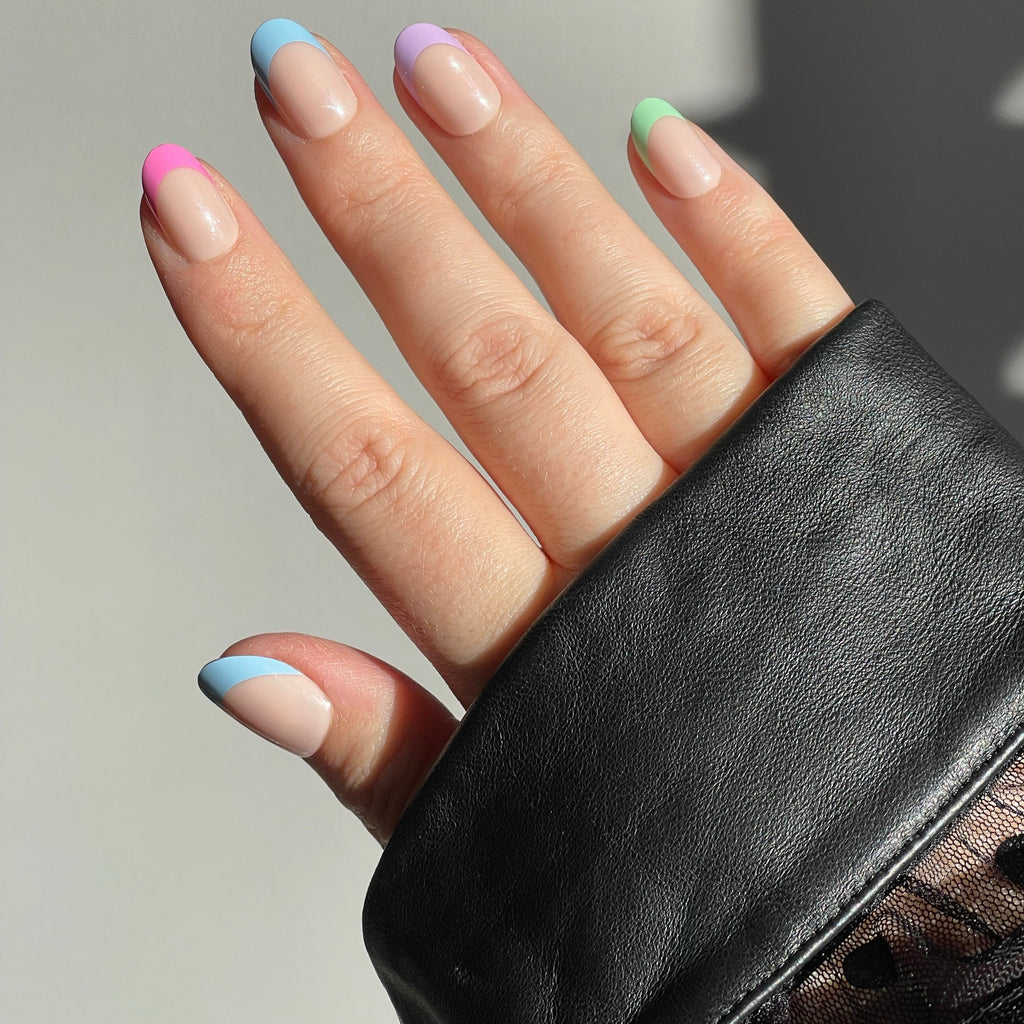Girl wearing long sleeve black top, also wearing Instant Mani Co. confetti press on nails 
