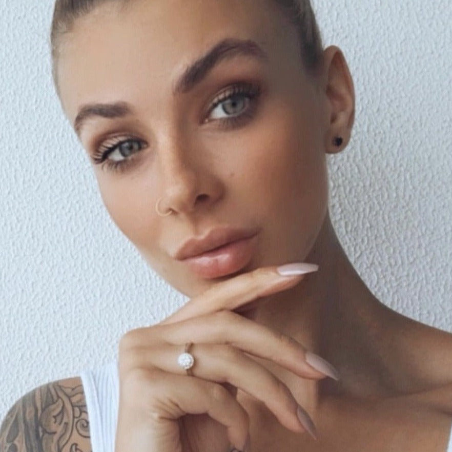 Girl wearing Instant Mani Co. nude press-on nails