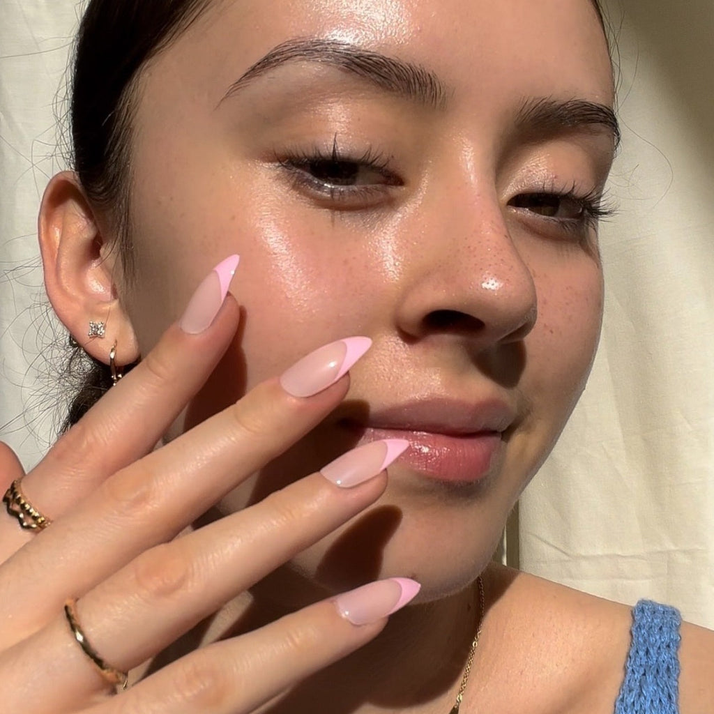 Girl wearing Instant Mani Co. Gossip, pink tip press on nails