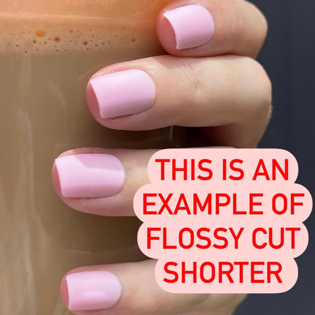 Hand holding pink coffee cup wearing pink matte Flossy Instant Mani Co, nails 