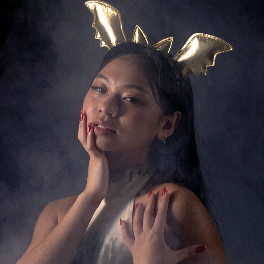 Girl surrounded in smoke, wearing red Instant mani Co. press-on nails